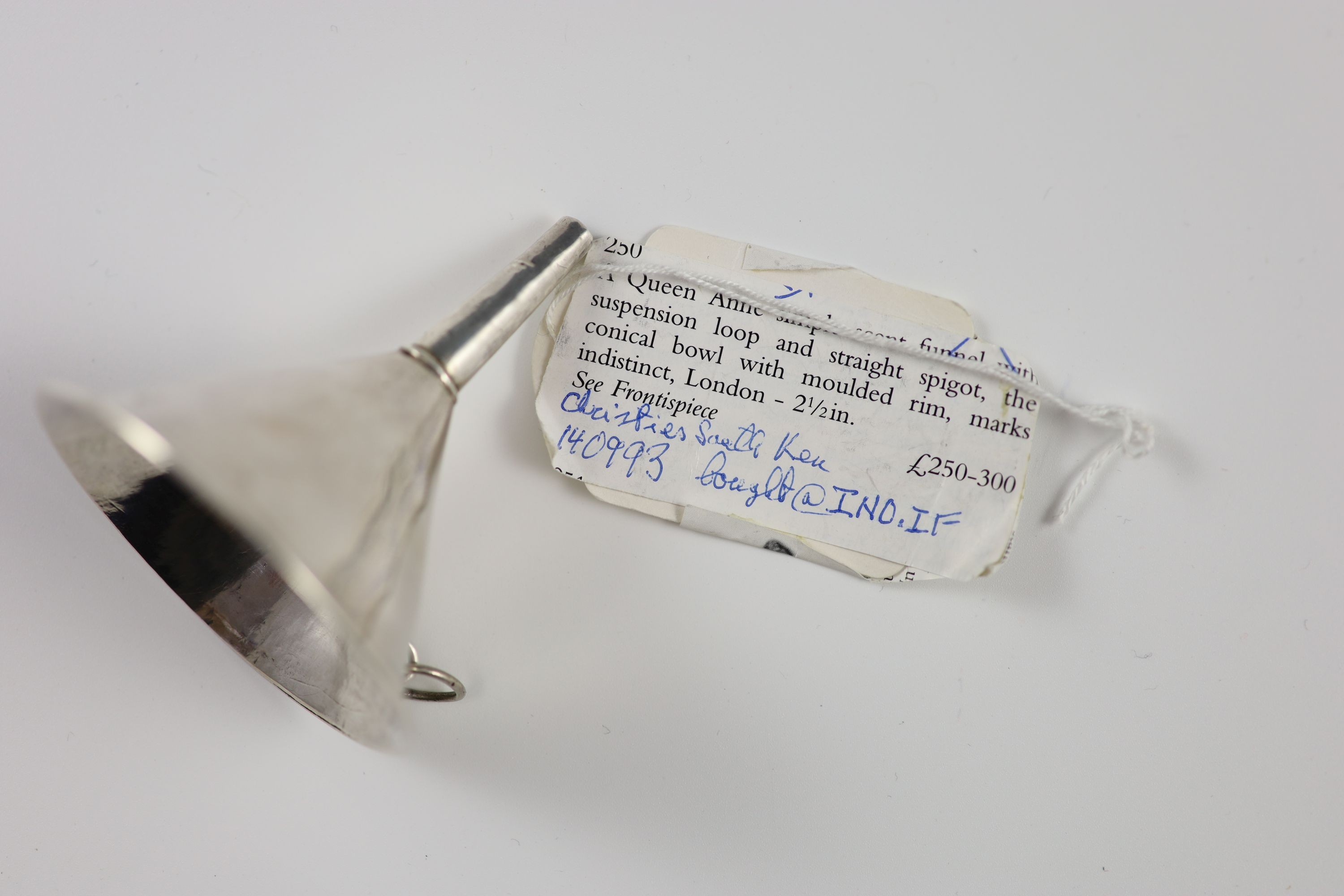 A Queen Anne small Britannia standard silver scent funnel